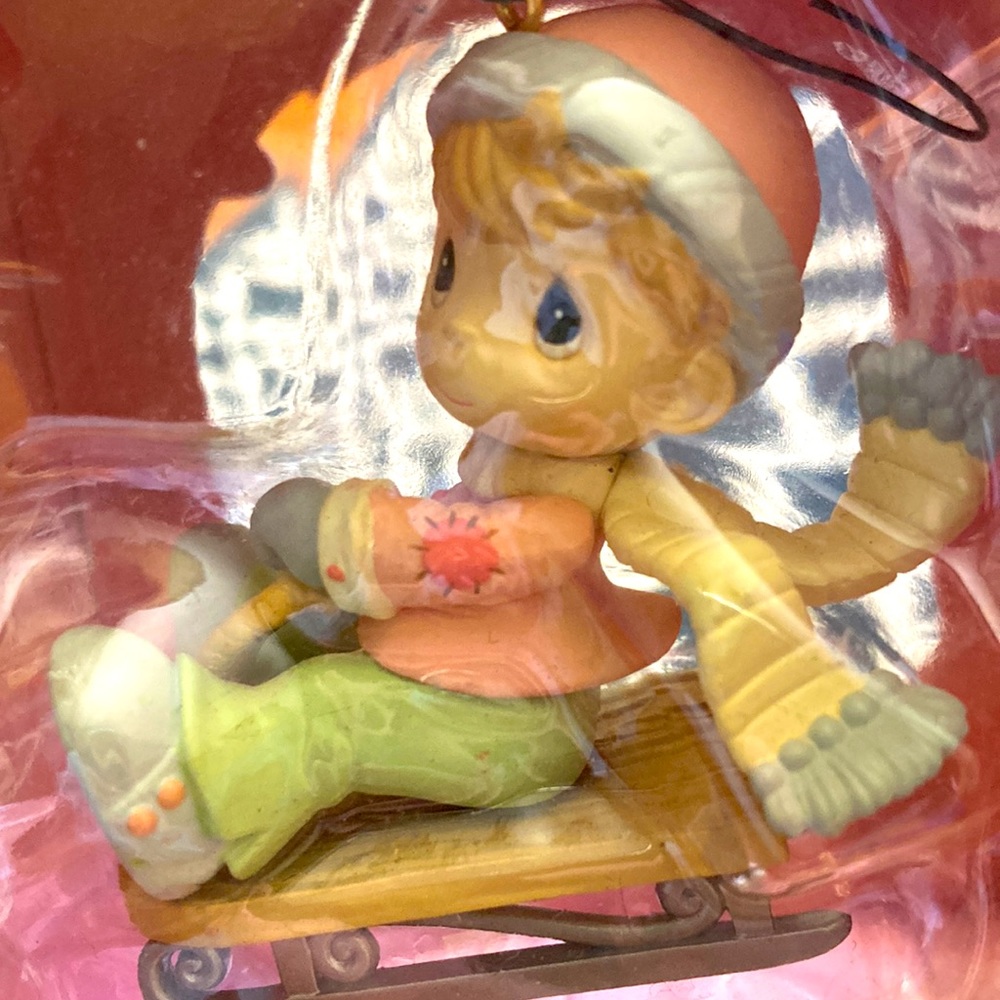 NWT precious moments home for the holidays collection ornament. Boy on a sledge